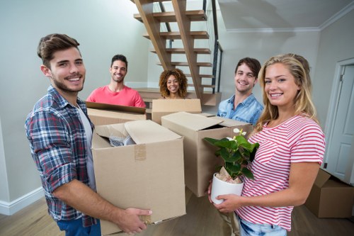 Professional man and van moving boxes in Kensington