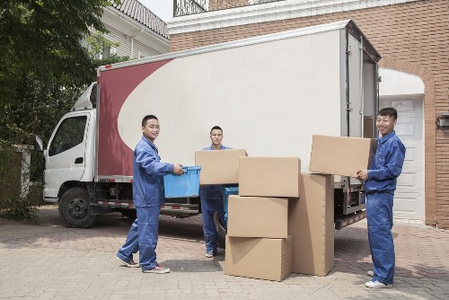 Moving van parked on a Kensington street near period homes