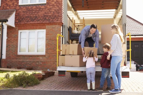 Moving van loading furniture and boxes for a Kensington service booking