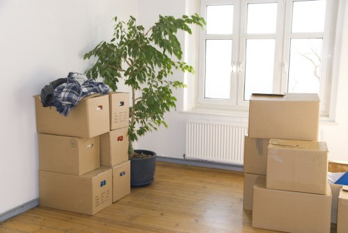 Business relocation preparation with labelled boxes and furniture in Kensington