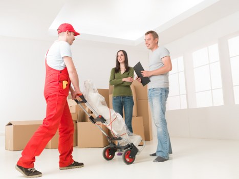 Professional man and van helping with furniture transport in Kensington