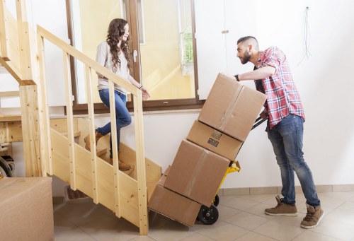 Packed boxes and furniture prepared for a home move in Kensington