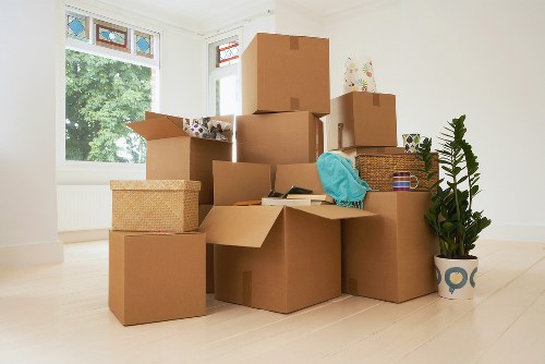 Removal team handling furniture in a Kensington apartment move