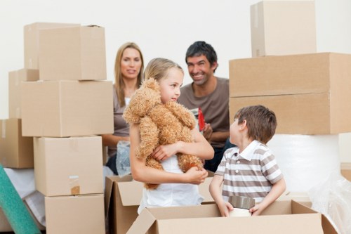 Team handling a household move with careful lifting and access planning